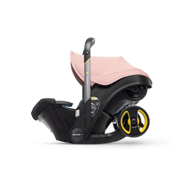 Doona in car seat mode with pink canopy