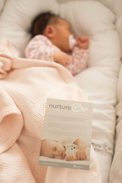 Nurture One Nesting Pillow with Baby Sleeping on her side